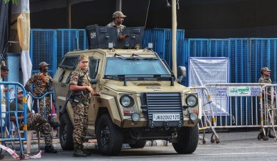 In Images: Armoured vehicle stands guard outside strongroom in Kolkata ahead of counting day