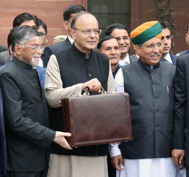 Finance Minister reduces the tax rate from 10 to 5 per cent for individual income between Rs 2.5 to Rs 5 lakh