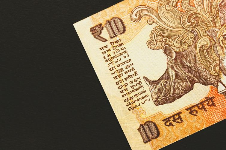 Indian Rupee up marginally by 3 paise against USD
