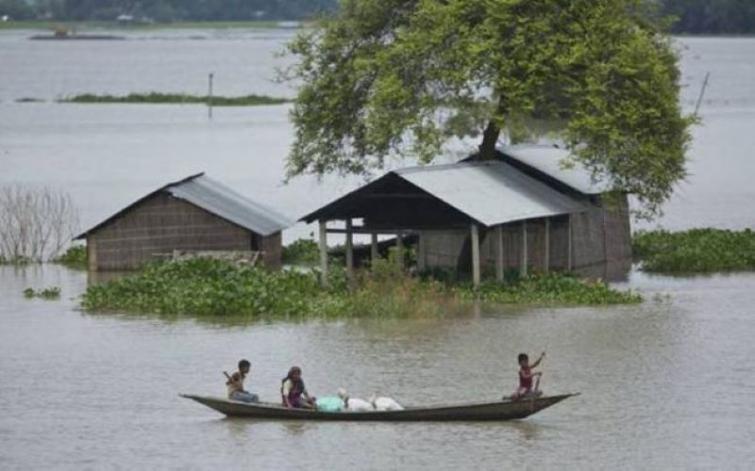 Assam villagers risk their lives to cross river by using rope after flood waters wash away the only bamboo bridge