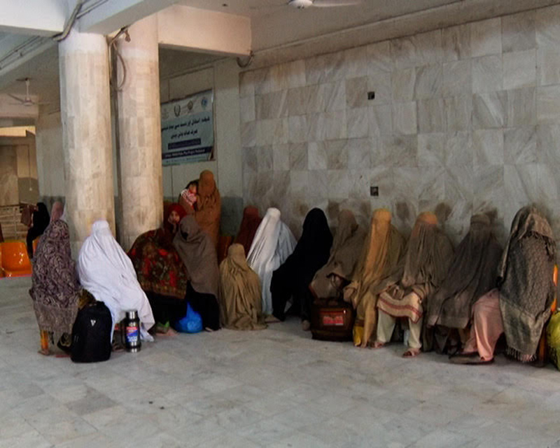 Women wait for checkups from a doctor at Lady Reading Hospital in Peshawar, Pakistan. Photo by Wisal Yousafzai.