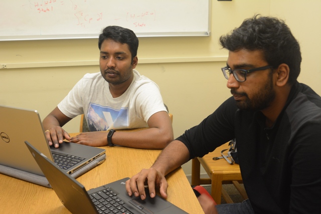 Sai Kumar Kovouri (left) and Rajesh Raghavan Balajiveeraragavan are discussing about their assignments in a study room in the University of Missouri, Columbia, Mo on Wednesday, April 19, 2017. Most of their work are finished on laptops.