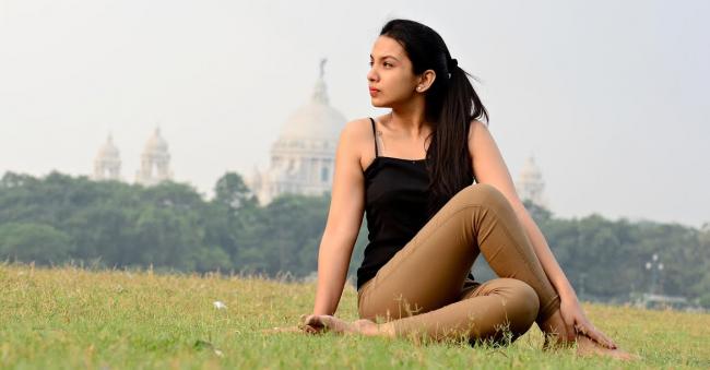 Sudeshna Sen, a 24-year-old student at St. Xavierâ€™s College in Maidan, Kolkata, practices yoga in front of the Victoria Memorial. Sen has been practicing yoga for three years and attends weekend classes at Power Yoga in Kolkata.