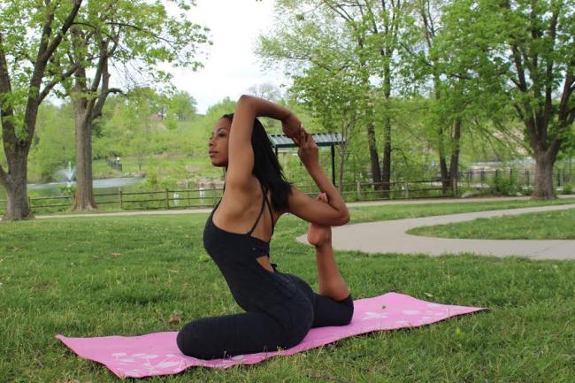 Melinda Oliver, of St. Louis, USA, practices yoga at Lake Stephens Park in Columbia, MO. Oliver in a senior at the University of Missouri and has been practicing yoga for two years. Oliver teaches community classes in Columbia, Missouri. She also began a program teaching yoga to 9th-grade girls to promote self-awareness, self-esteem and mental health.