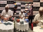 Indian writer Amitav Ghosh signs copies of his new book The Living Mountain for Kolkata readers
