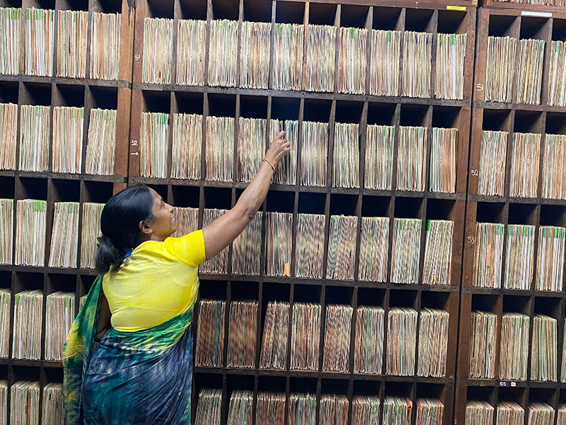 Subhashini De Silva, Record Librarian, showing old records at the Hindi Language library of the station.