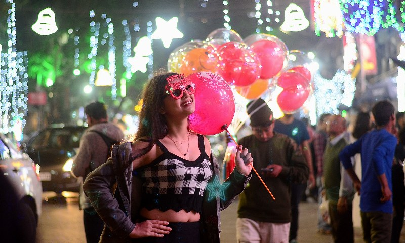 People enjoy Christmas celebrations with joy and laughter in Kolkata’s Park Street.