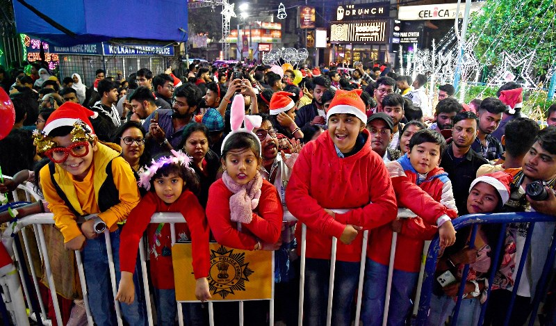 People enjoy Christmas celebrations with joy and laughter in Kolkata’s Park Street.