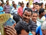 As India runs short of cash, queues grow longer outside banks