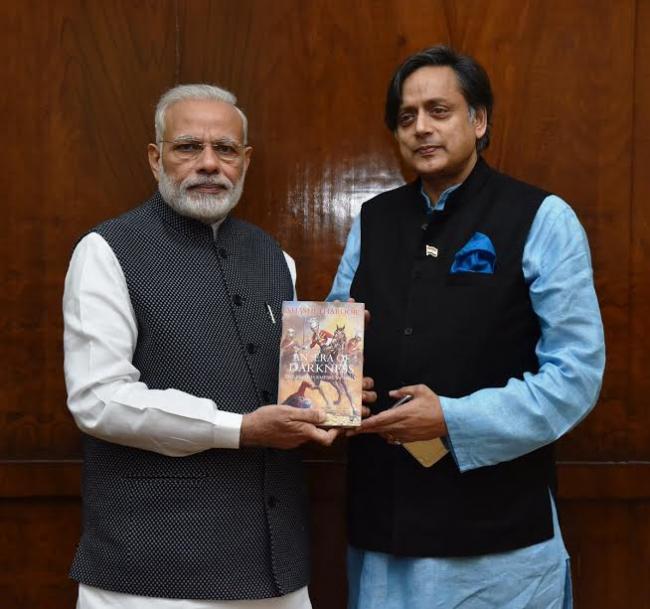 Shashi Tharoor presents copy of his book to PM