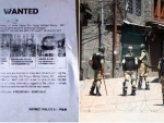 Kashmir police put up posters for information on militants who killed an army officer
