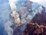 Indian Air Force using helicopters with Bambi Buckets to control forest fire in Jammu's Katra 