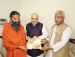 Amit Shah meets Yoga guru Swami Ramdev