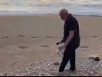 Indian PM Narendra Modi uses plogging to pick up trash at Mamallapuram beach