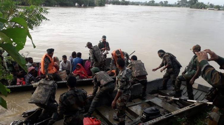 Indian army, Assam Rifles personnel rescue villagers in flood-hit Dimapur in Nagaland