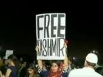 Woman holding 'Free Kashmir' placard apologizes