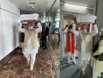 Union Minister Hardeep Singh Puri receives three Swaroops of Guru Granth Sahib evacuated from Afghanistan