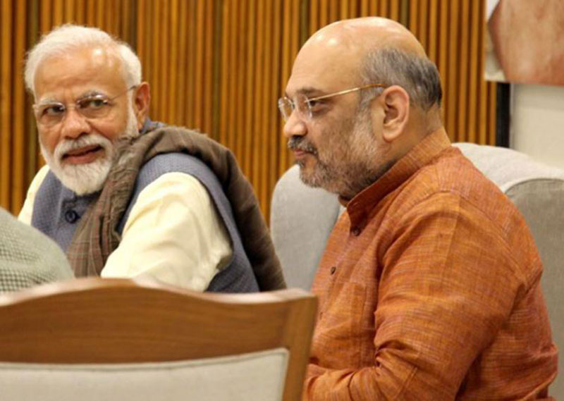 Amit Shah congratulates PM Modi on completing 20 years of public service