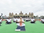 Yoga brings peace to our society, says Narendra Modi as he participates in Mass Yoga Demonstration at Mysore Palace ground