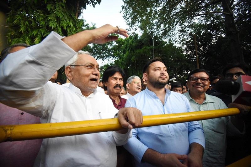 BJP only knows to divide people: Tejashwi Yadav with Nitish Kumar as they stake claim to form Bihar govt