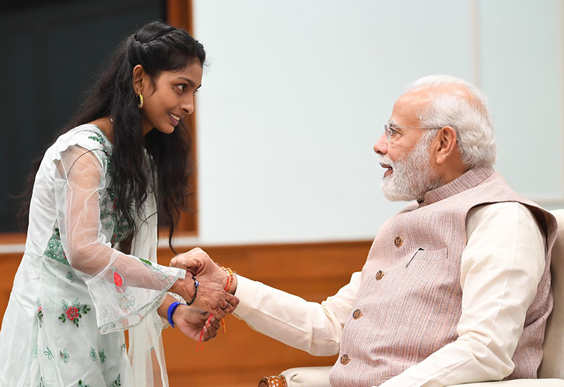 PM Modi celebrates Raksha Bandhan with young girls