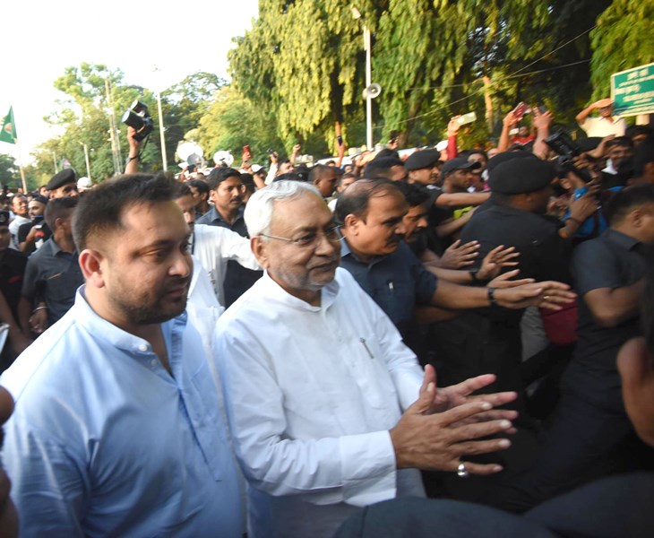 Nitish Kumar along with Tejashwi Yadav outside Raj Bhawan in Patna/ Image credit: UNI
