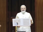 PM Modi unveils commemorative stamp and Rs 75 coin to mark the inauguration of new Parliament building