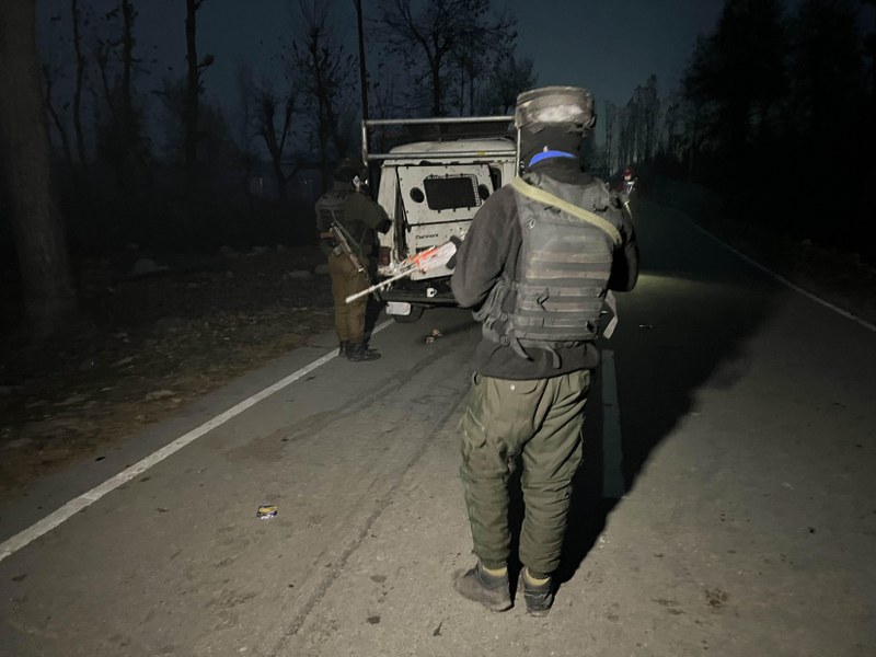 Security personnel stand guard amid the Kulgam encounter with militants on Thursday. (Photo Courtesy : UNI) 