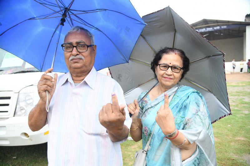 Voters showing indelible ink mark after casting their votes at a polling booth during the 3rd Phase of General Elections-2024 at Guwahati, in Assam. (Image credit: PIB)