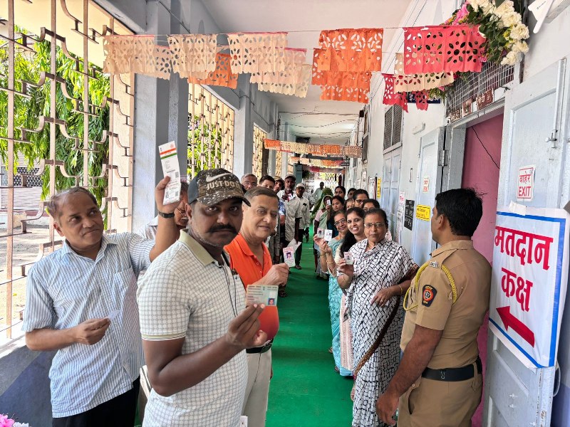 Voters displaying identity cards as they queue up to cast votes at polling booth during the 3rd Phase of General Elections-2024 at Maharashtra