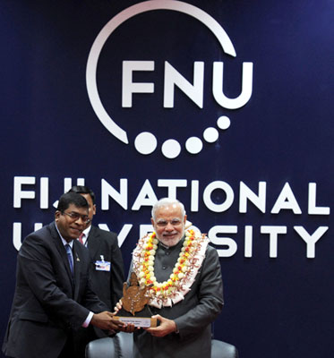 Modi being received on his arrival, at Nausori International Airport