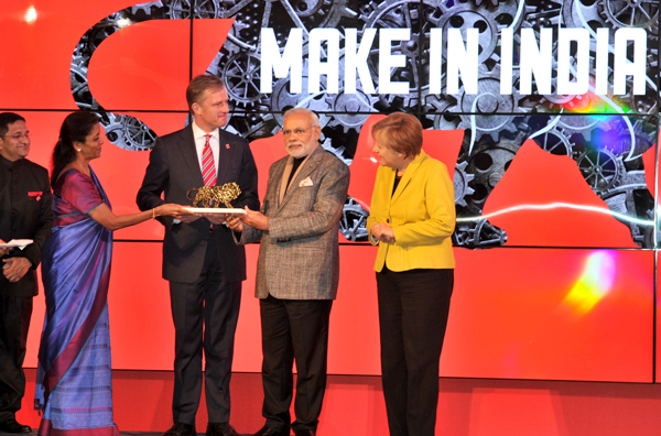 Modi and the German Chancellor, Ms. Angela Merkel at the Joint Inauguration of the India Pavilion and the Joint Walk-About Make in India
