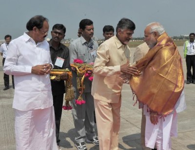  Narendra Modi being welcomed on arrival by the Chief Minister of Andhra Pradesh