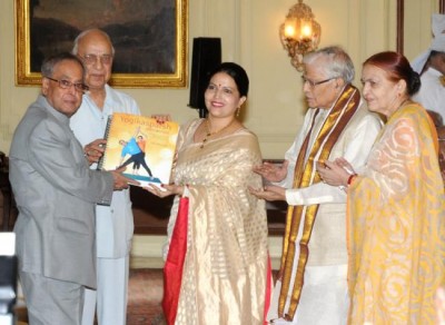 President Pranab Mukherjee  receives first copy of yoga manual in Braille 