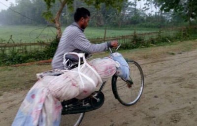 Assam CM orders probe into man carrying brother's body tied to bicycle in Majuli district