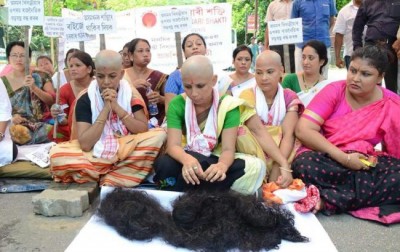 To secure indigenous peopleâ€™s rights women activists stage protest by shaving off head in Guwahati