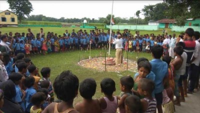 Assam boy in last year Aug 15 photo saluting the tricolour flag in chest-deep flood water, excluded in final draft NRC