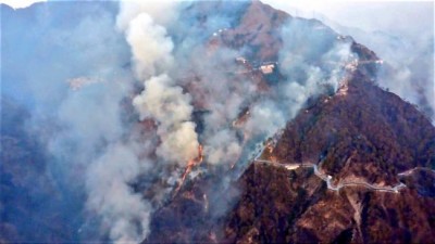 Indian Air Force using helicopters with Bambi Buckets to control forest fire in Jammu's Katra 