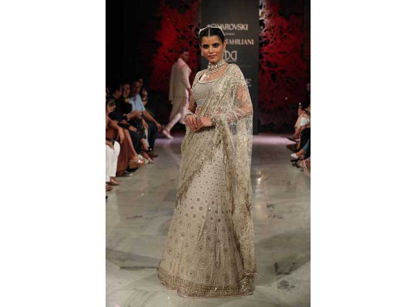 Models walk the ramp for Tarun Tahiliani's show