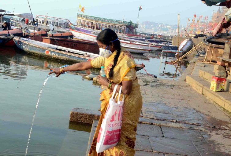 Woman offers obeisance to Ganges in locked down Varanasi