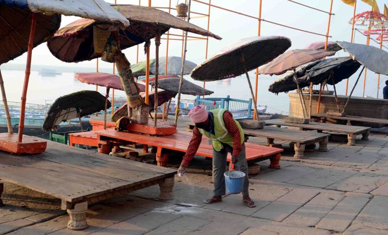Woman offers obeisance to Ganges in locked down Varanasi