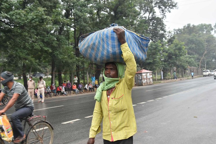 Labourers in safe place during rain and wind before cyclone Amphan