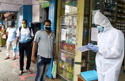 People queue up in front of pharmacies in Kolkata