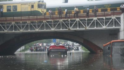 Two dead as heavy rains lash Delhi flooding roads