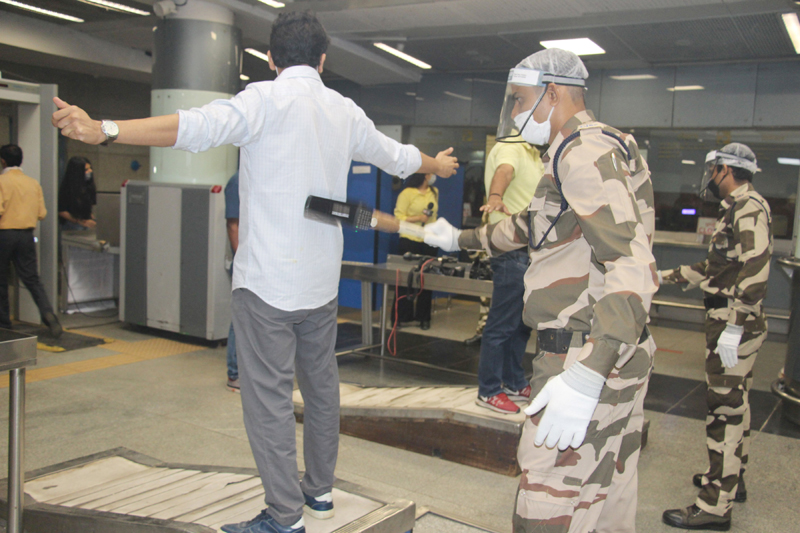 DMRC workers sanitizing Rajiv Chowk Metro Station ahead of resumption of metro services