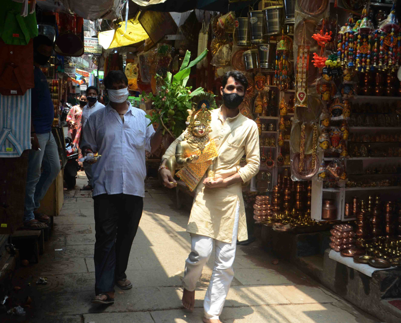 People in Varanasi taking home Laddoo Gopal idols on Janmashtami