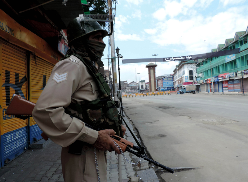 Security personnel guard Srinagar roads to prevent Muharram procession on Sunday