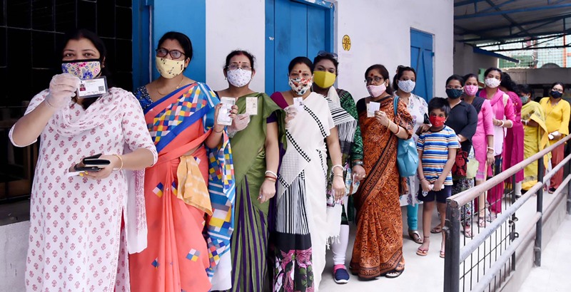 Voters waiting in queue at Thakurpukur polling station in Kolkata during Bengal Assembly Elections