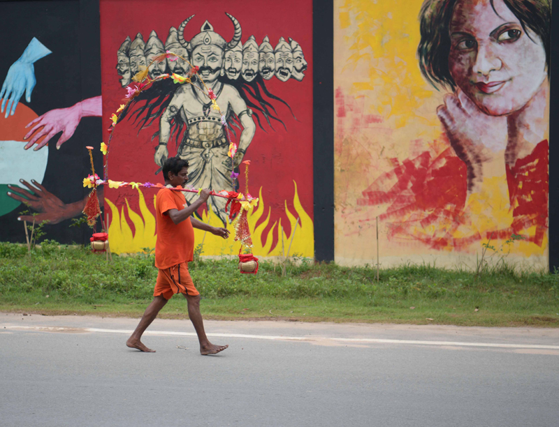 Shrawan in Agartala: Kanwarias carrying containers of holy water
