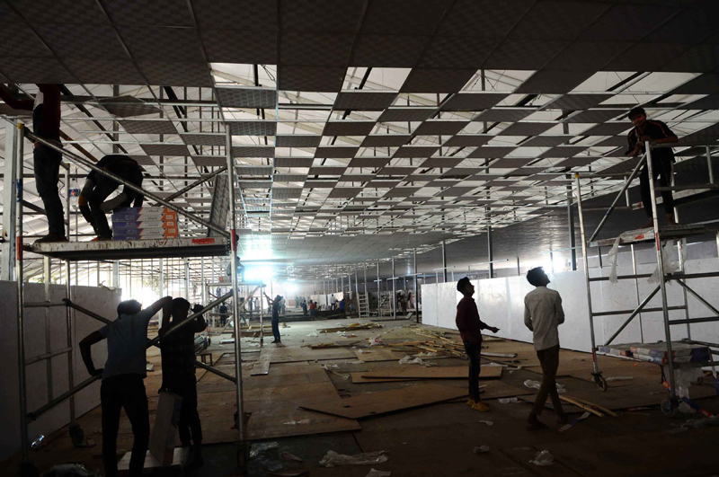 New Delhi: Workers constructing temporary COVID-19 care centre